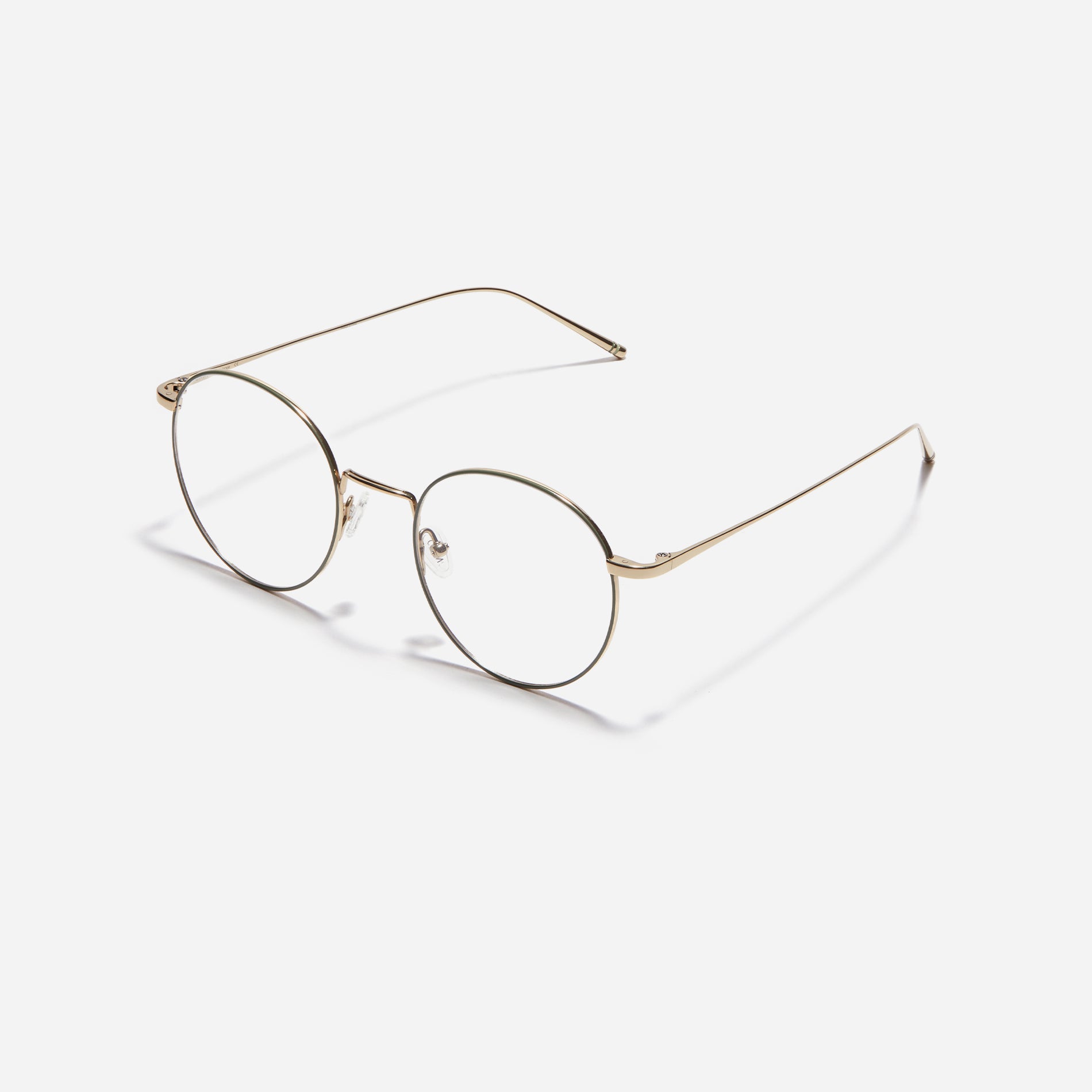 Round-shaped eyeglasses that naturally complement all face shapes. Crafted entirely from titanium, the frame provides exceptional durability and featherweight comfort, while its design adds a touch of casual charm to one's daily style.