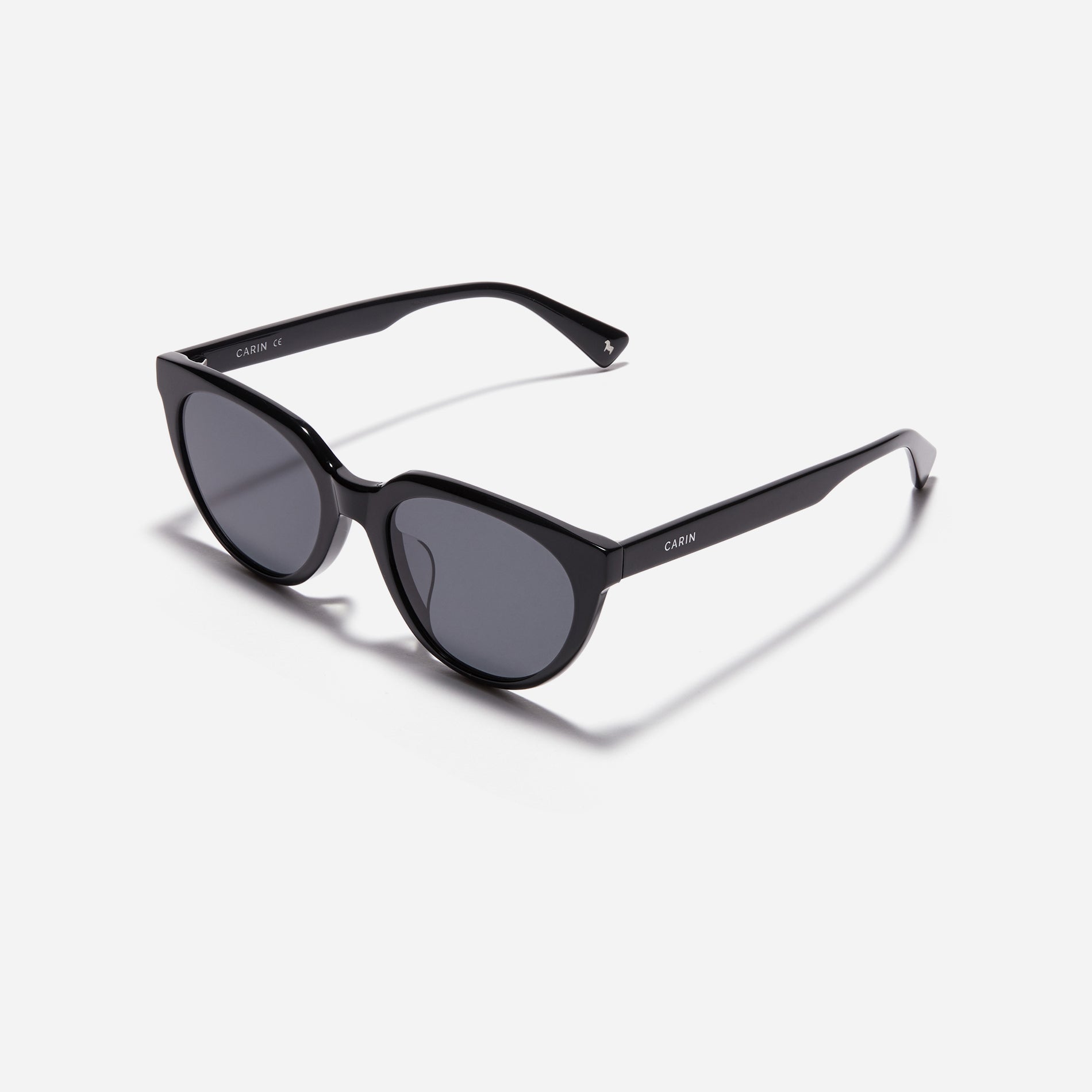 Chic cat-eye sunglasses. Featuring smooth curves on the upper surface, these sunglasses offer enhanced comfort with their lightweight yet durable frame.