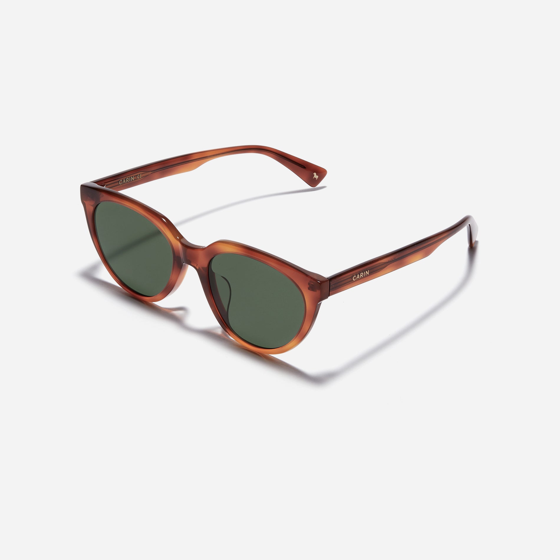 Chic cat-eye sunglasses. Featuring smooth curves on the upper surface, these sunglasses offer enhanced comfort with their lightweight yet durable frame.