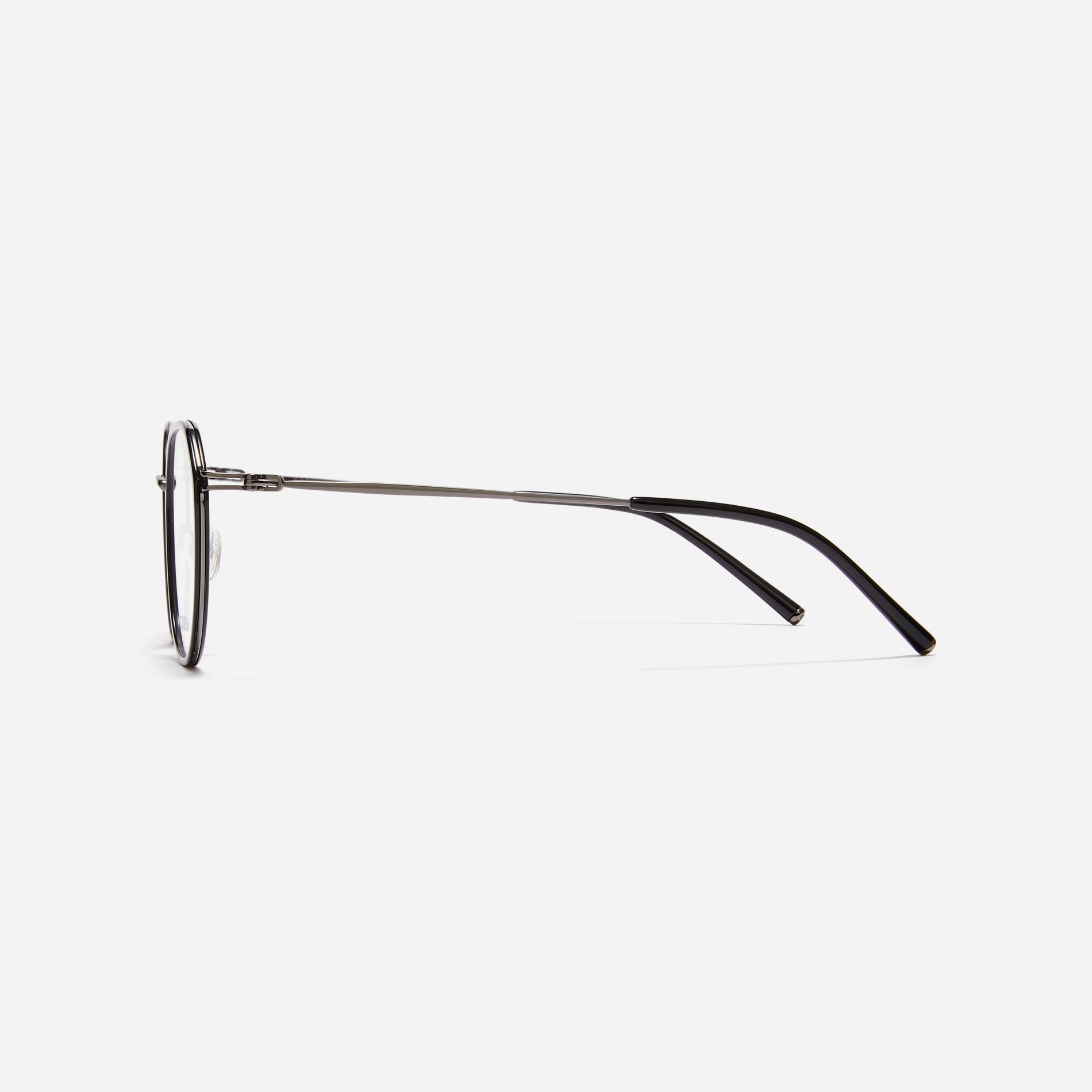 Combination eyeglasses featuring a harmonious blend of a polygonal lens shape and an acetate frame. These eyeglasses are characterized by a delicate acetate rim that secures the frame and hinge details. The slim temples, made from lightweight and elastic B-Titanium material, ensure a consistently comfortable fit.