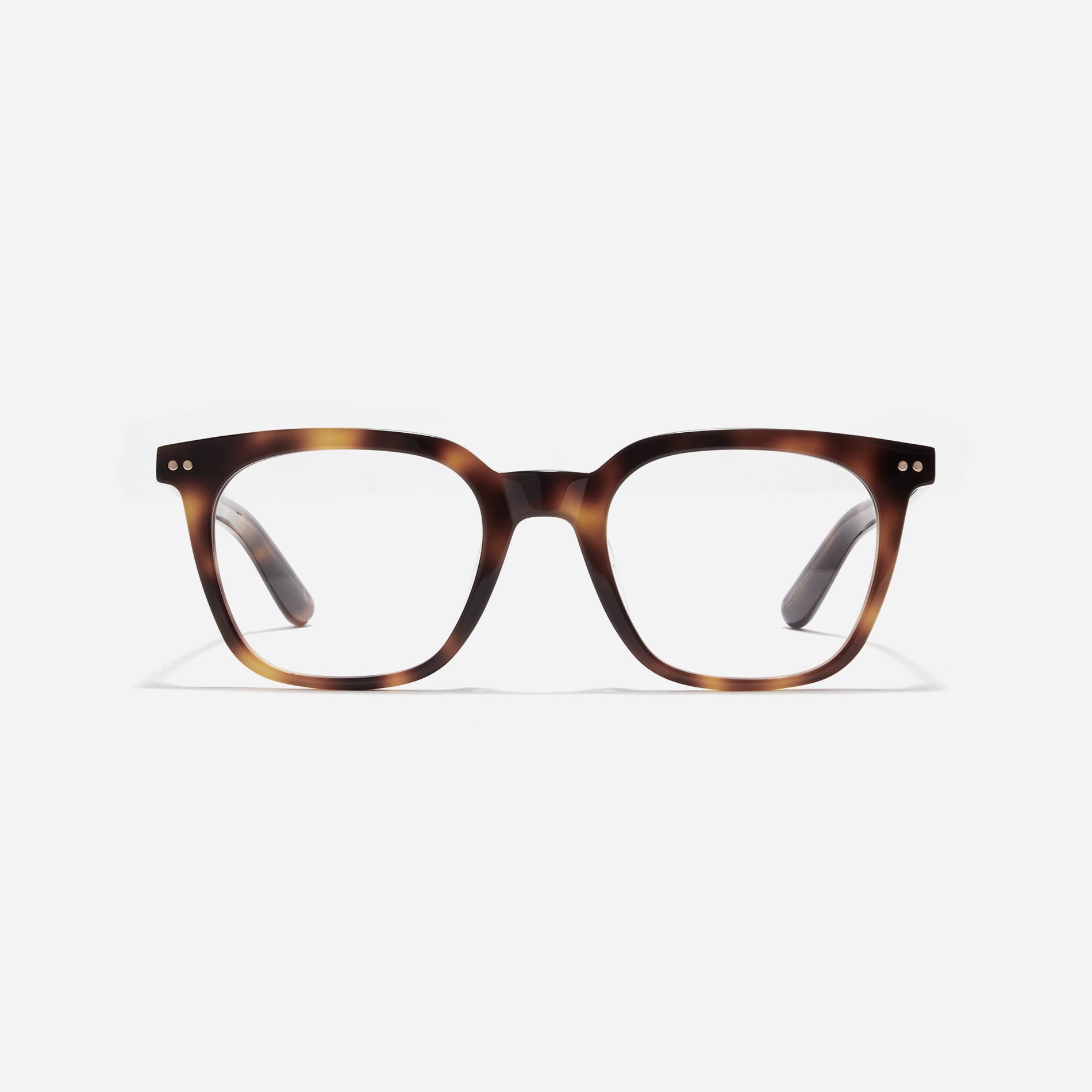 Square-shaped horn-rimmed eyeglasses. Embodying a modern reinterpretation of '91s retro vibes, their design is created for effortless styling. Featuring a distinctive bold frame and a stylish polygonal shape, these eyeglasses are available in a variety of colors.
