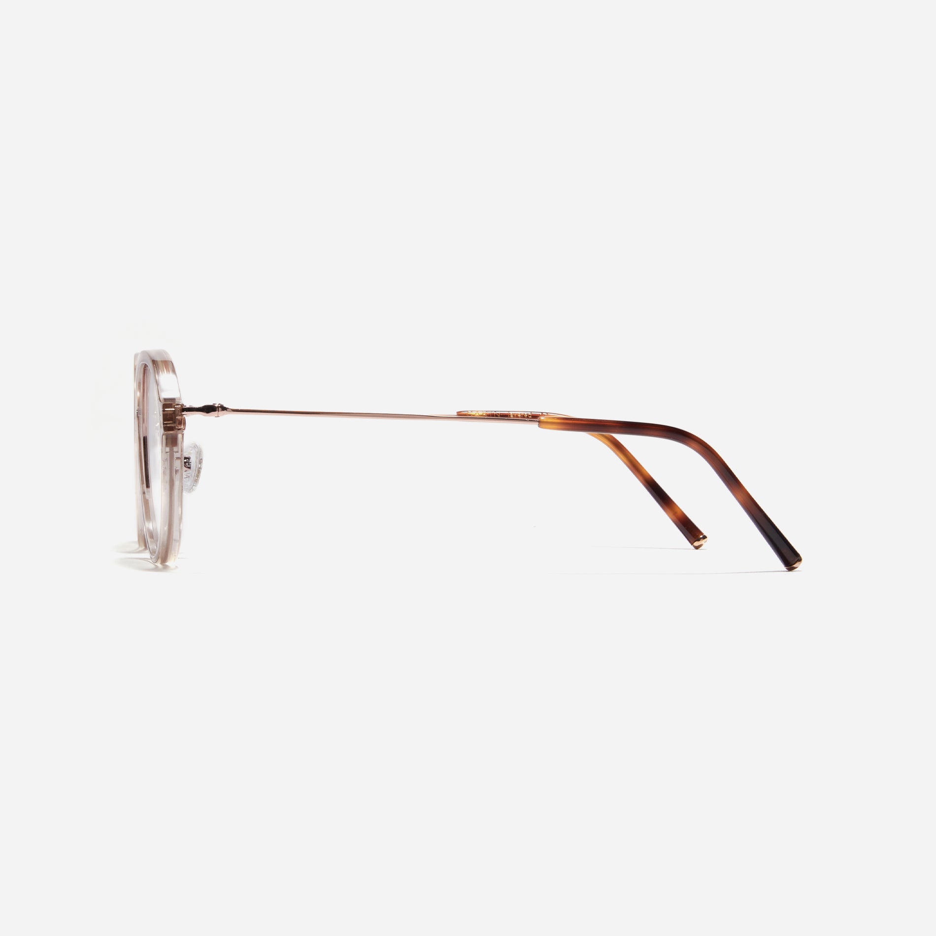 Round-shaped eyeglasses with a dual-combi structure inspired by from the aesthetics of platform shoes. Their dual-rim structure seamlessly accommodates thick lenses for higher prescriptions, while retro vibes are accentuated by side color accents.